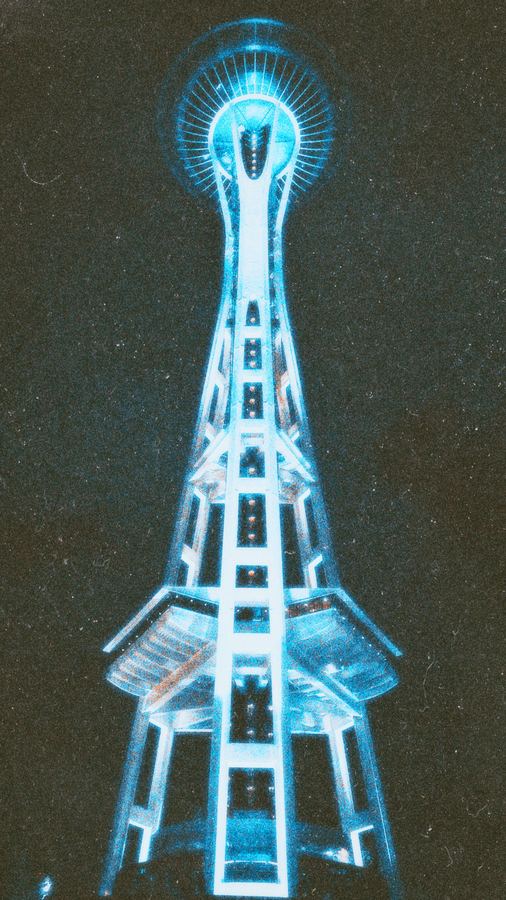 A tower glowing blue against a grainy night sky